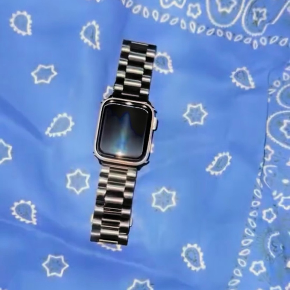 Apple Silver Smartwatch with Black Display and Stainless Steel Band